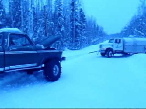 Ford pickup pulls out a fully loaded fuel truck