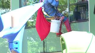 Super heroes wash windows outside Akron Children's Hospital