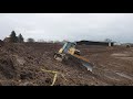 CAT D6K2 pushing topsoil