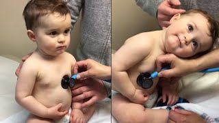 Baby Rests Head On Nurses Hand