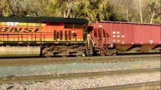 Full HD A BNSF C44-9W and two EC44DC locomotives pull a unit grain train.