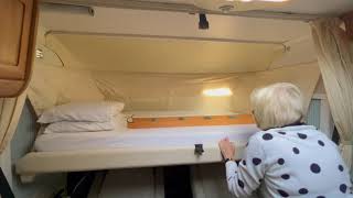 24. Lowering the drop down bed