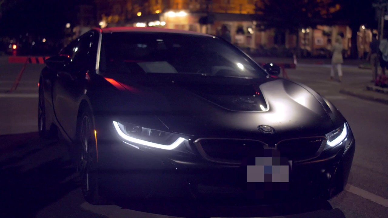 Wesley James getting out of a BMW i8 Coupe