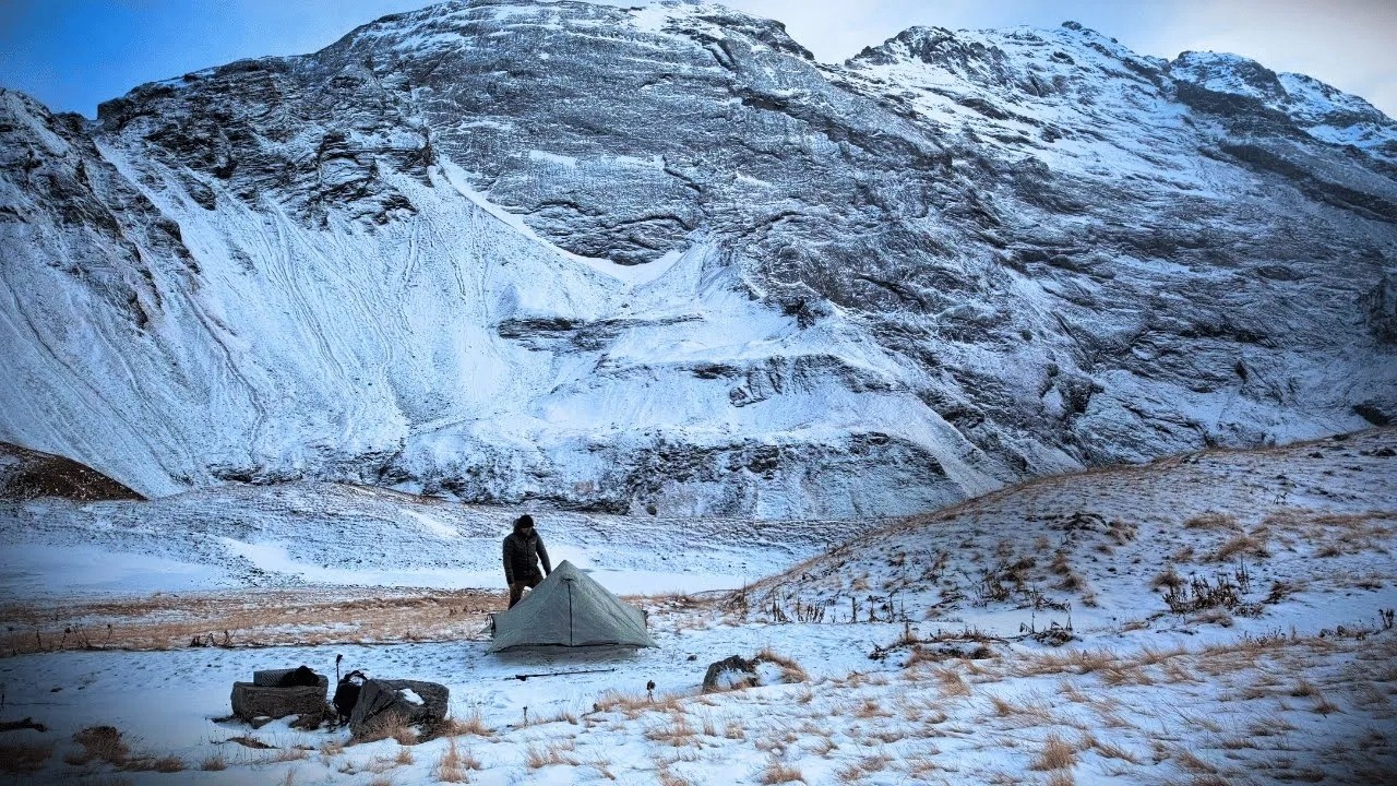 Solo winter hike to a frozen waterfall in the swiss alps