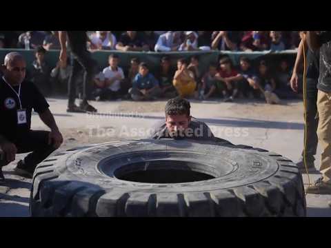 Palestinians gather amid rubble to cheer competitors in Palestine Strongman Championship