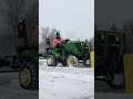 John Deere 1023E blowing snow.