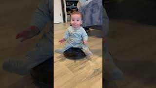 Precious Baby Takes a Roomba Ride as Another Watches