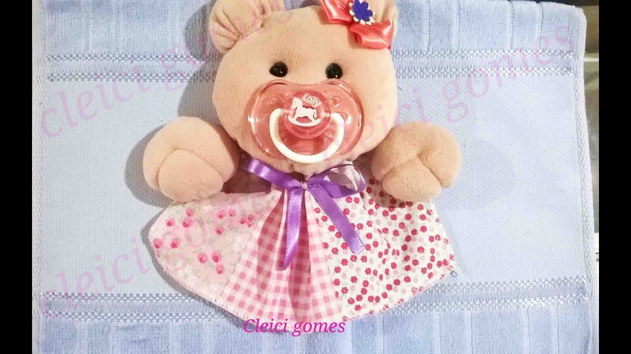 Toalha com urso de chupeta