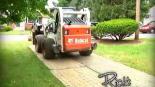 Our Bobcat A300 all wheel steering loader moves tree debris while minimizes the damage to your turf.