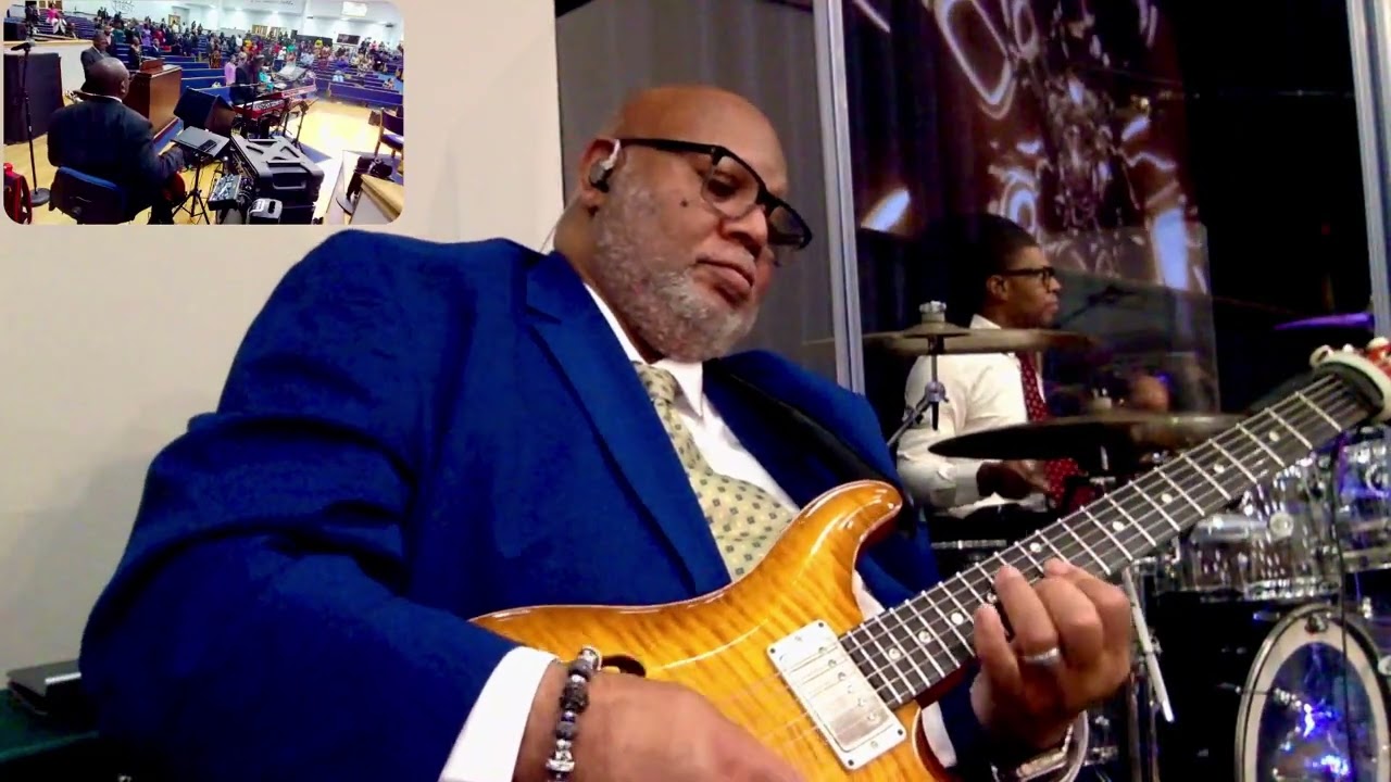 Playing the guitar over a hymn.