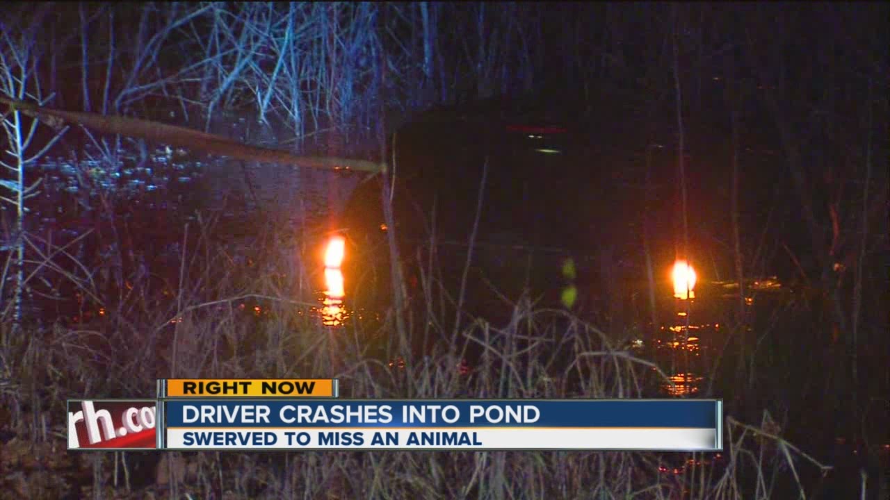 Driver Crashes Into Pond - YouTube
