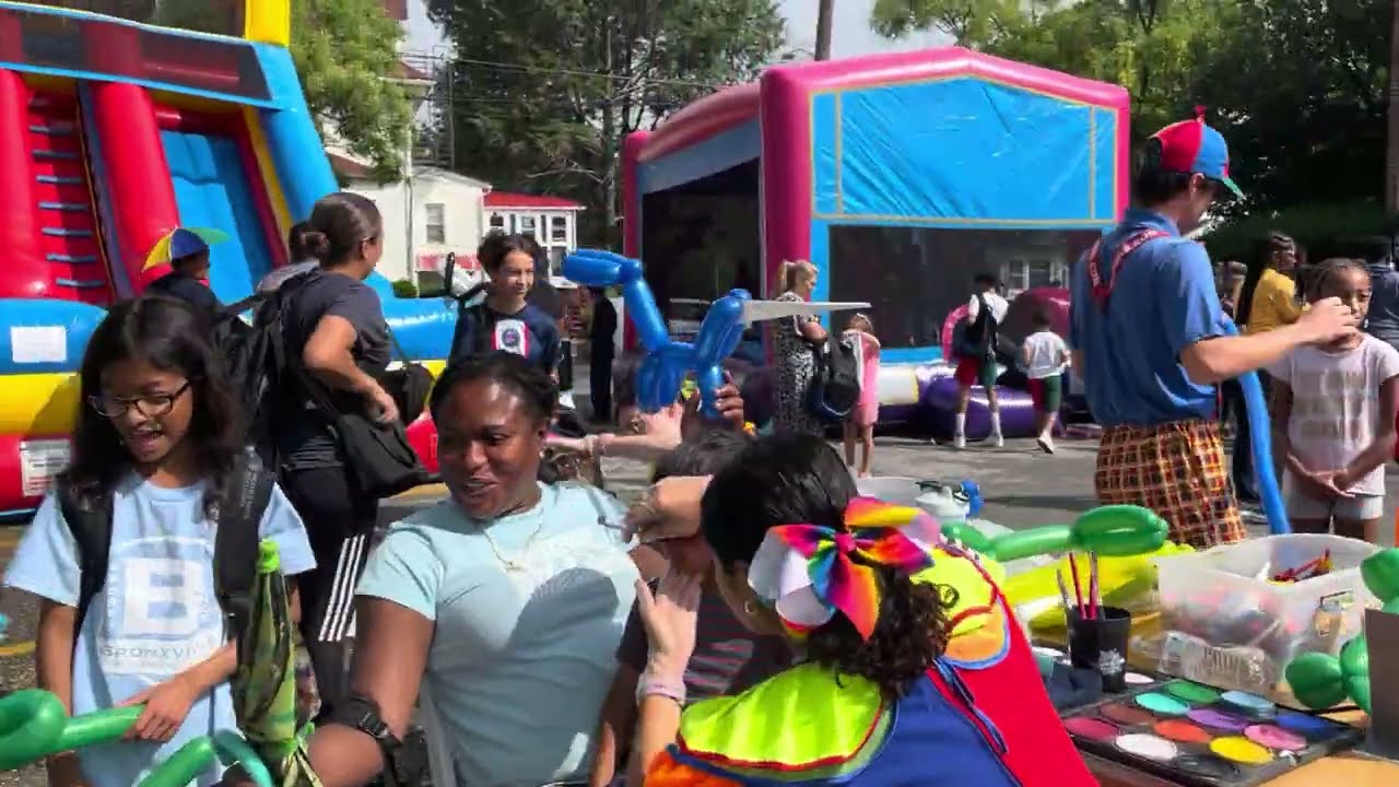 News 12 Giveaway Backpacks at Edward Williams School