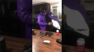 Rapper Hitmanfloyd Pull 100 Guns Out A Jacket On Set Of Gucci Gang 