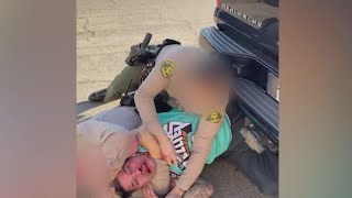 Deputy punches man already in chokehold by another cop