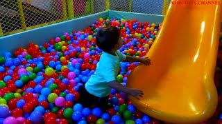 Pool balls pit and more toys  in playground for children.Kid fail. Funny video