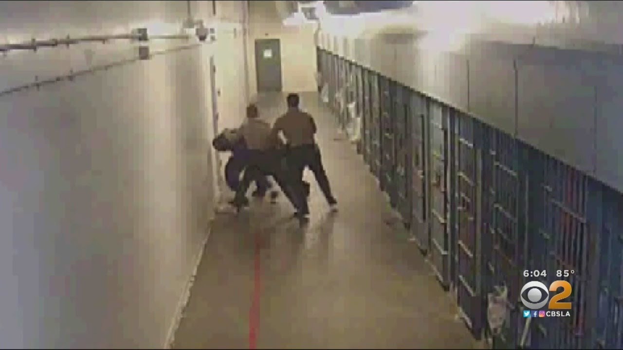 out of the Los Angeles County jail appears to show deputies taking aggressi...