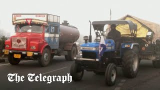 Farmers' tractor protest heading for New Delhi blocked by police barriers