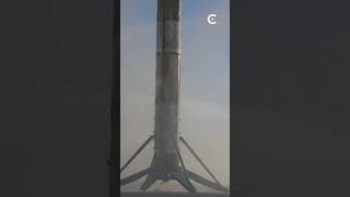 SpaceX Falcon 9 booster returns to Earth and lands with precision.