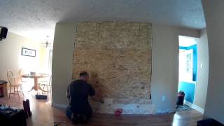 Remove the mock fireplace / mantle from our entry way and replacing it with a plank wall.