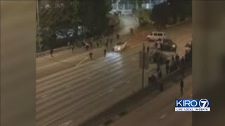 VIDEO: Two protesters injured after car drives into crowd on I-5