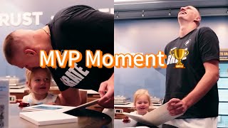 Nikola Jokic shares a moment with his daughter while watching his NBA MVP tribute video