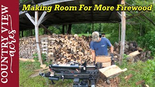 Splitting and Stacking Firewood.  Organizing the wood pile, making room for more.