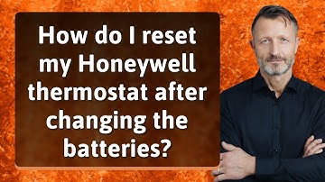 How do I reset my Honeywell thermostat after changing the batteries?