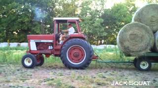 Unloading Dumping Round Bales Of Hay