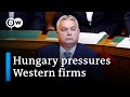 Western firms lament rising pressure in Hungary | DW Business