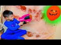 Den with Nerf vs Halloween balloons