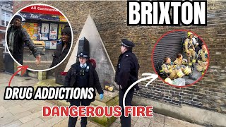 GEVAARLIJKE BRAND!! Mensen proberen een gedenkbeeld in Brixton in brand te steken.