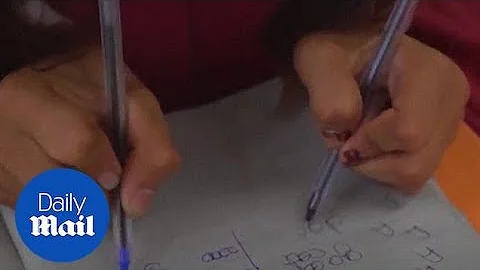 School in India teaches children how to write with both hands - Daily Mail - DayDayNews