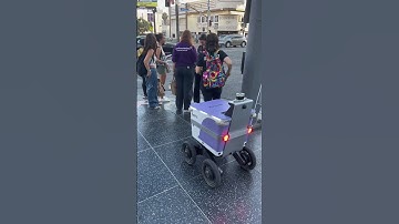 Autonomous delivery robot in city environment#robotdelivery #urbantech #futuristiccity