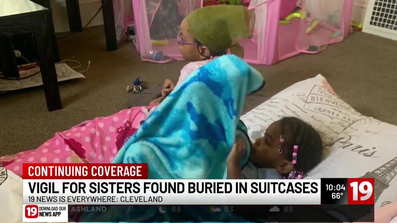 Vigil held at site where bodies of 2 girls found in suitcases in Cleveland