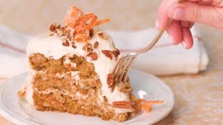 This carrot cake is one of our all-time favorites. made with grated
carrots, pieces granny smith apple, and sweetened coconut, the
resulting layers a...