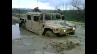 Career Overview Comm Co hummer stuck in mud.