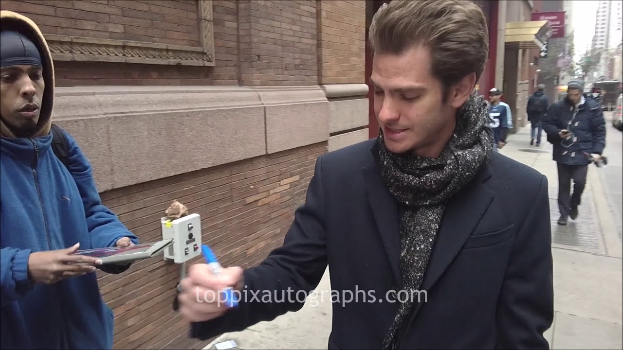 Andrew Garfield signs autographs for TopPix