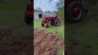 Farmall 140 laying off tomato rows