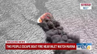 Crews extinguish boat fire at a private dock by the Carolina Beach Inlet