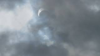 Solar Eclipse on a cloudy day.