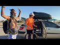 Meeting fellow car camper while cooking at the beach