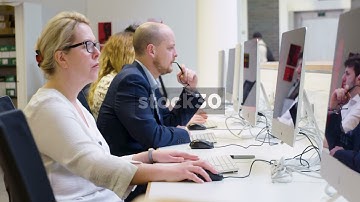 4 People Using Computers In Computer Lab - Wide Shot And Close Up