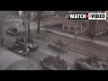 Russian military vehicles move through Kherson, Ukraine