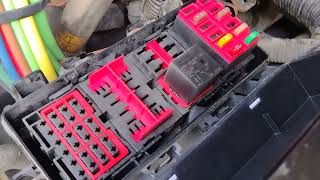 What electric fuses bulbs and relays sit under the hood of Freightliner truck