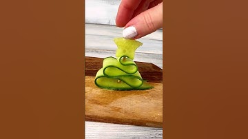 Cucumber Christmas tree like a snow globe. Perfect holiday decor! #ChristmasDIY #FoodArt #SnowGlobe