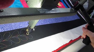 Ann long arm quilting a simple feather, In the border on March 2, 2014. Part 2