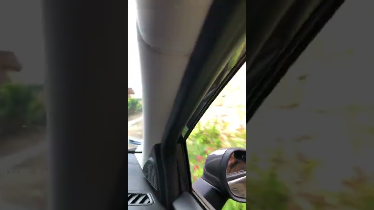 A drive up a steep hill towards a medieval castle.