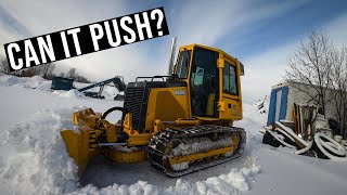 plowing the yard out with the bulldozer