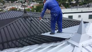 Airless spray painting a roof