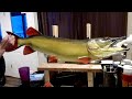 Painting a pike carving